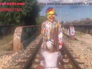 Clown almost gets hit by train while getting head